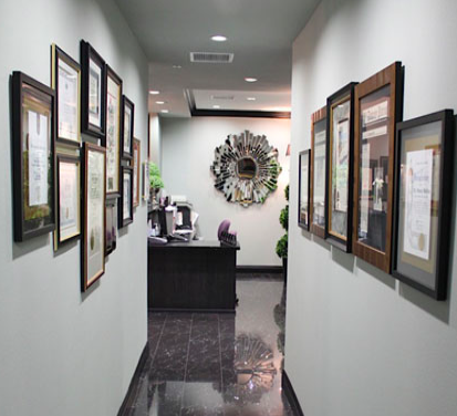 Credentials hallway with framed diplomas